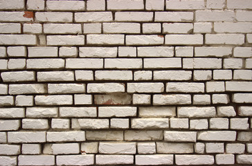 White vintage brickwork with large slots in it