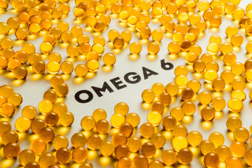 Inscription on white background flax seeds omega 6 fish oil. Health food supplements medicines, concept.