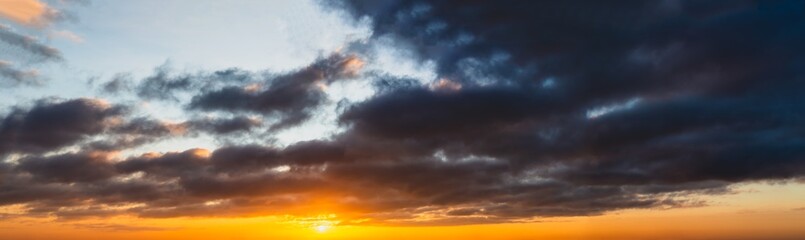 Obraz premium Fantastic dark thunderclouds at sunrise