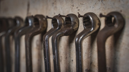 wrenches rusty old tools in the line on the bench