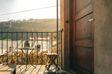 Tea table at the balcony in warm morning sun.