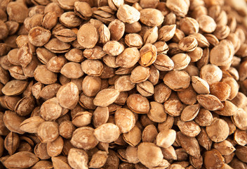 Salted dried apricot kernels in the Turkish market. Traditional treat, snack.
