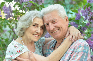 Close up portrait of beautiful senior couple hugging