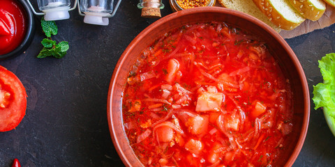 red tomato soup and vegetables and meat, borsch (Russian or Ukrainian cuisine) menu concept background. top view. copy space
