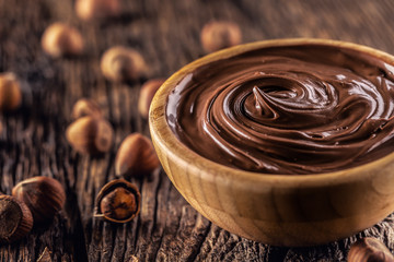 Chocolate hazelnut spread in wooden bowl - Close up
