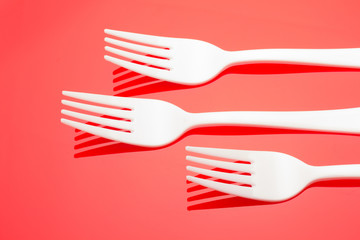 Plastic fork for casual food. White fork.