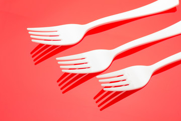Plastic fork for casual food. White fork.