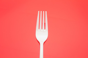 Plastic fork for casual food. White fork.
