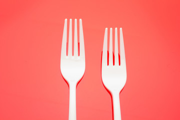 Plastic fork for casual food. White fork.