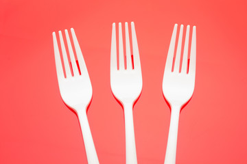 Plastic fork for casual food. White fork.