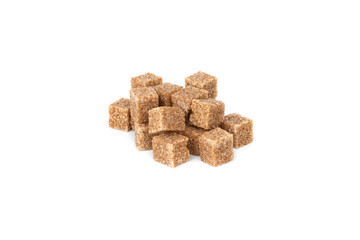 Cane sugar on a white background. Cane sugar cubes close up.