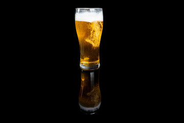 glass of beer on black background
