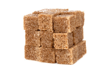 Cane sugar on a white background. Cane sugar cubes close up.