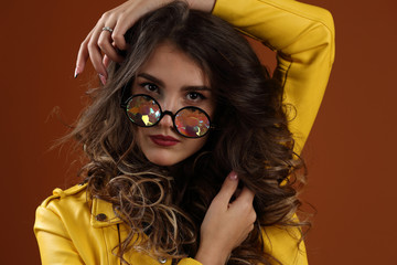 Portrait of a beautiful girl with kaleidoscope glasses