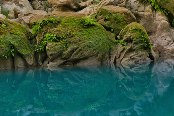 Amazing crystalline blue water of Tamul waterfall, Close up view of spectacular Tamul River,at Huasteca Potosina in San Luis Potosi, Mexico