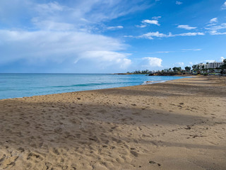 sunny landscape with ocean and clouds