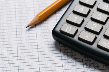 Accounting, financial concept, flat lay, calculator and pensil on wooden table