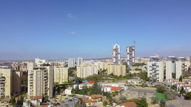 Slow panoramic from buildings to the tombs on old cemetery in Beer Sheba city