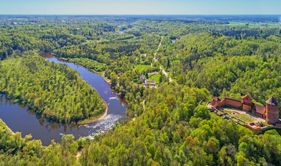 Obraz premium Beautiful aerial view of medieval Turaida castle at Gauja river valley, Sigulda, Latvia