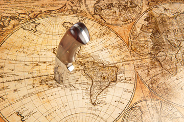 Knife sticking in a old Map to locate the Treasure