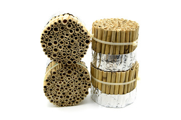 self made insect hotel of bamboo sticks. isolated background