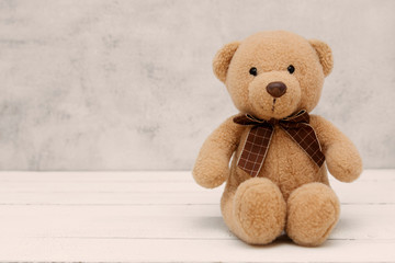 Teddy Bear soft toy on grey background, isolated. Education, parenting and childhood baby concept. Copy space.