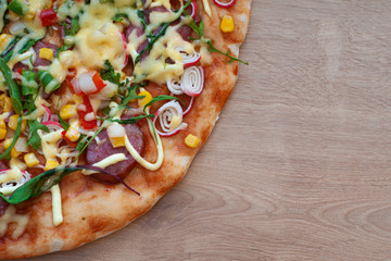 pizza on the wood background. copy space.