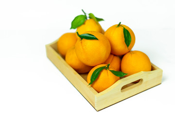 oranges on a wooden box. Fresh fruits, food on a white background, isolate