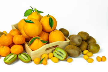 Tropical fruits in bulk: orange, mandarin, kumquat, kiwi. Fresh fruits, food on a white background.