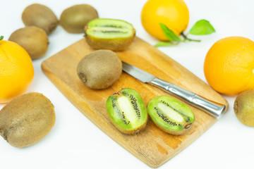  cut orange on a wooden board. Fresh fruits, food on a white background.