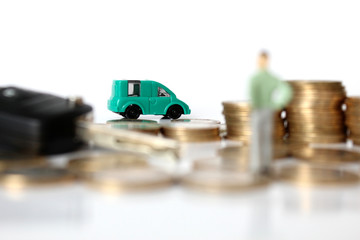 Miniature people with coins and car. Miniature businessman walking through a toy car. Concept of financial, retail, money saving and business. Turkey car price infilation. Car mortgage related