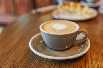 Coffee cup fresh cream organic cappuccino on table in cafe