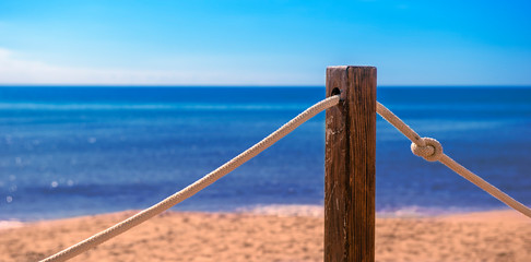 panorama of a beach with stake