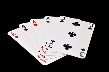 The combination of playing cards in poker on black background - Four of a Kind 