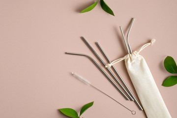 Reusable drinking straws made of stainless steel metal with case. Flat lay, top view. Zero waste, plastic free concept. Sustainable lifestyle.