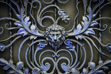 The fragment of forged metal products. lion, close-up