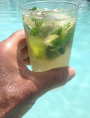 glass of water with lemon on the beach