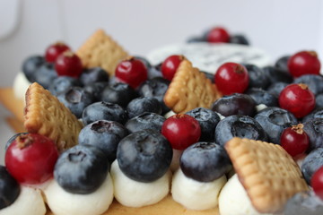 Tasty cake with fresh berries and grocery
