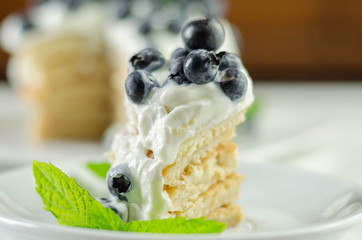 Delicious pancakes with sweet creamy yogurt and fresh berries with mint