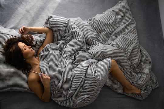 Pretty, Young Woman In Her Bed, Fast Asleep. Importance Of Sleep Concept