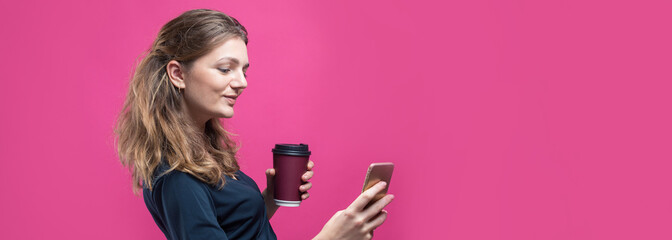 Obraz na płótnie Canvas Glamor woman with a drink of coffee on a pink background.