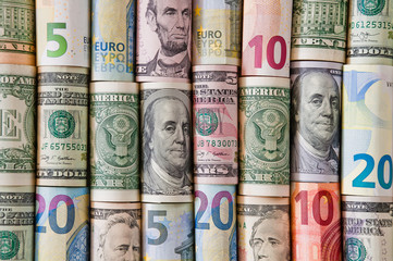 Background of twisted dollar and euro banknotes