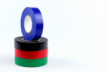 PVC insulation tape for wires. Multi-colored skeins on a light background.