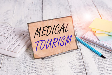 Conceptual hand writing showing Medical Tourism. Concept meaning traveling outside the country to...