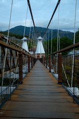 Suspended Bridge Connecting Olaya City and Santa Fe City, with Wooden Planks with a Pedestrian Part and another for Small Vehicles and Motorcycles