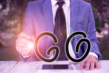 Handwriting text writing Go. Conceptual photo to move or travel somewhere in order to do something Leave or depart Businessman holds pen and points into copy space