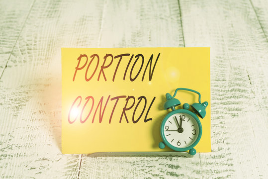 Writing Note Showing Portion Control. Business Concept For Knowing The Correct Measures Or Serving Sizes As Per Calorie Alarm Clock Tilted Above Buffer Wire In Front Of Notepaper