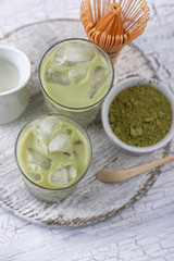Cold matcha tea with milk and ice