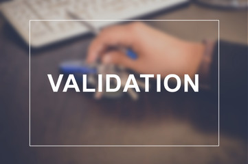 Validation word with business blurring background