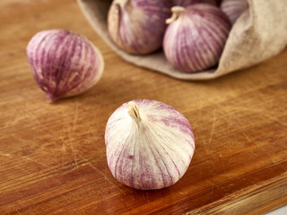 Fresh garlic on market table closeup photo